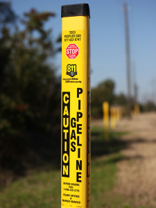 A closer look at an underground gas line marker.
